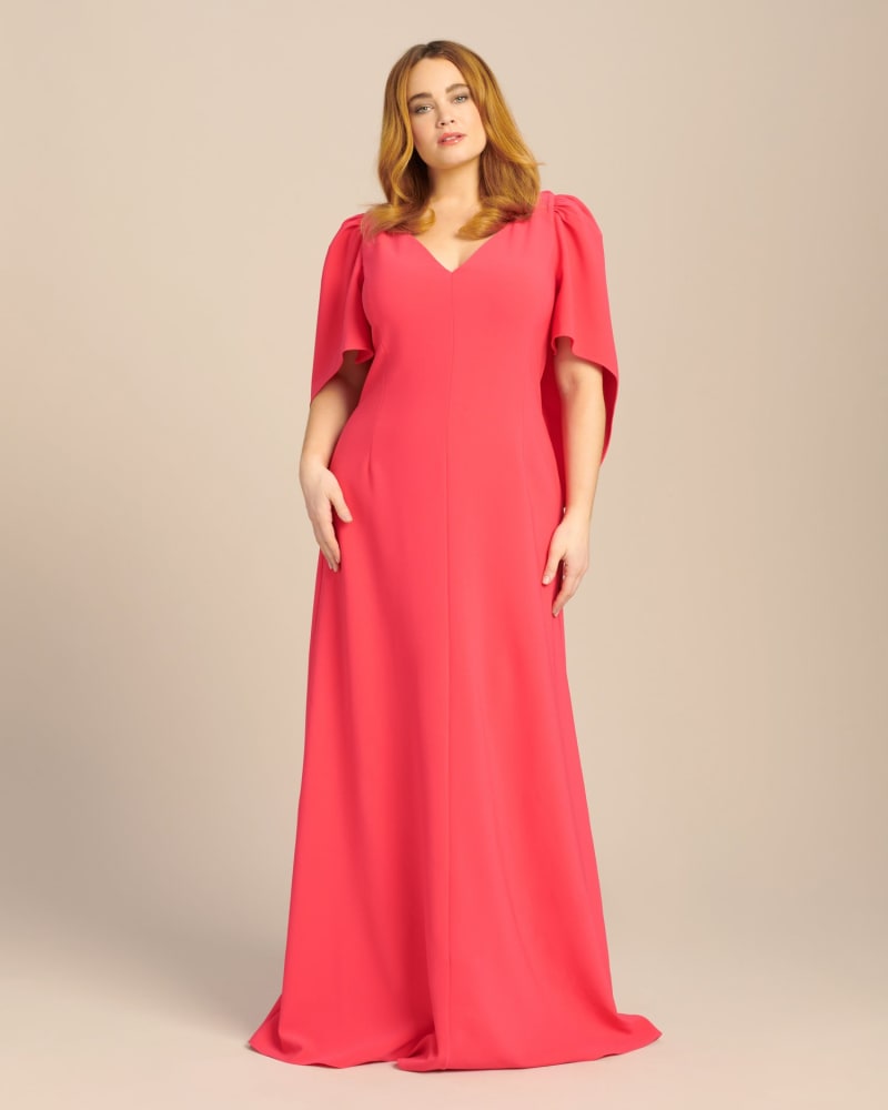Front of a model wearing a size 16 V-Neck Gown with Cape and Open Back in Coral by Carolina Herrera. | dia_product_style_image_id:225285